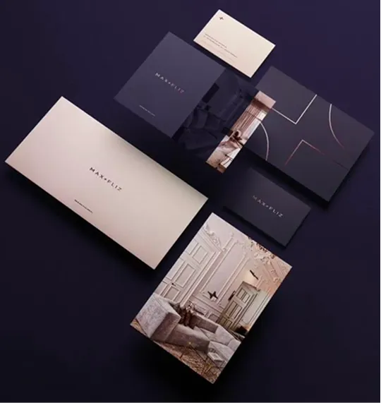 Dark purple stationery with gold linework, business cards and printed brochures.