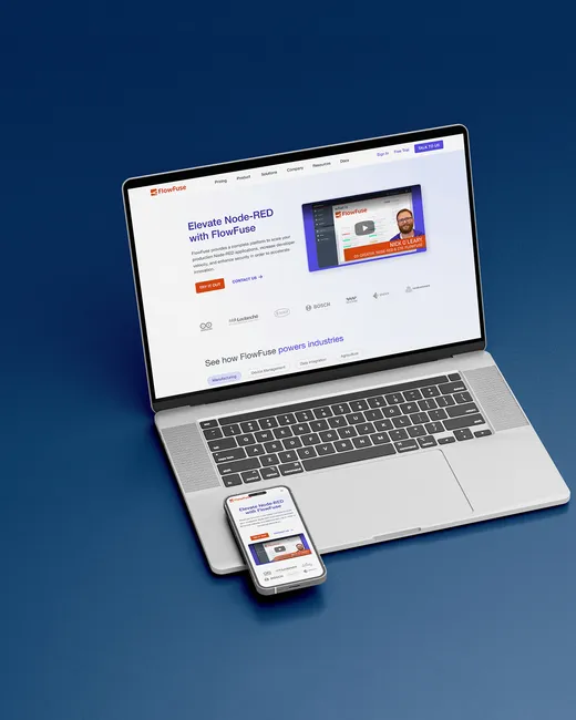 FlowFuse website shown on a laptop and phone against a blue background.